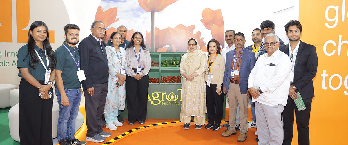 Visitors walking the exhibition floor at a large Indian agri trade fair